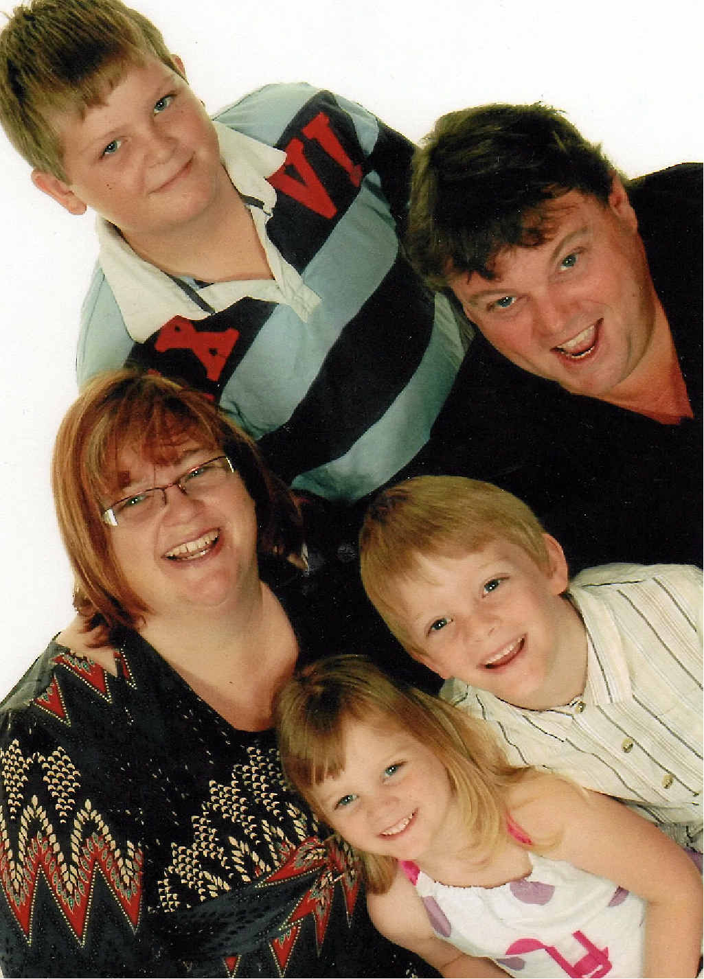 TEENAGE YEARS: Mitchell Luders is turning 13 this Sunday. He is at home in Gladstone on a short break from treatment for a cancerous tumour in his abdomen. Mitchell, in white, is pictured with his family.